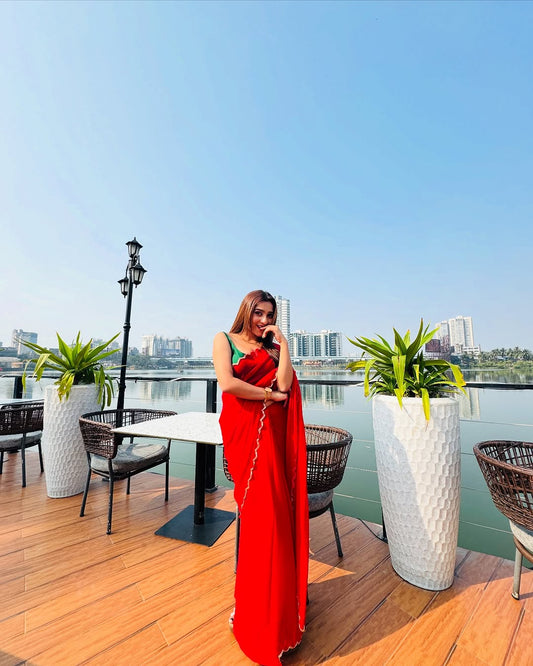 Elegant Red Saree with Golden Handwork Border & Green Blouse – Festive & Party Wear